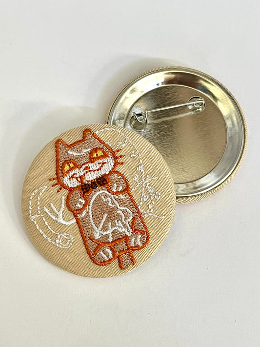 embroidered pinback button - hannibal kitty clock